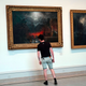 Somebody getting close, but no closer than appropriate to a painting at the Brooklyn Museum. Photo via Getty.
